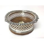 Good quality antique silver plated coaster with gadrooned and pierced borders with turned wooden bas