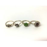 Four 9ct gold gem set dress rings