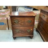 Nineteenth century flame mahogany chest of two deep drawers with brass swing handles, 62cm wide, 45c
