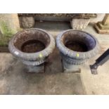 Pair of cast iron garden urns/planters, 48cm diameter, 46cm high