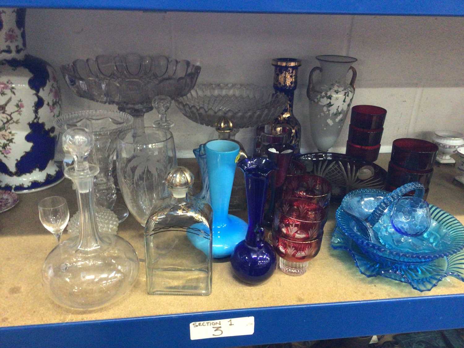 Collection of antique and later glassware, including cut cranberry glasses, decanters, etc