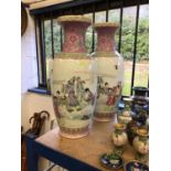 Large pair of Chinese famille rose porcelain baluster vases, 20th century, painted with figures and