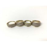 Four 9ct gold diamond set thick banded rings