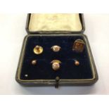 Five 9ct gold studs in case and a pin stamped 10k