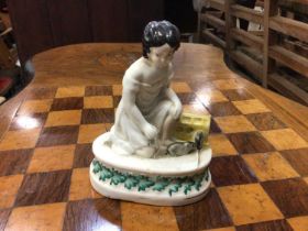 Unusual Victorian Staffordshire figure of a girl with two rats or mice, the oval base decorated with