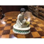 Unusual Victorian Staffordshire figure of a girl with two rats or mice, the oval base decorated with