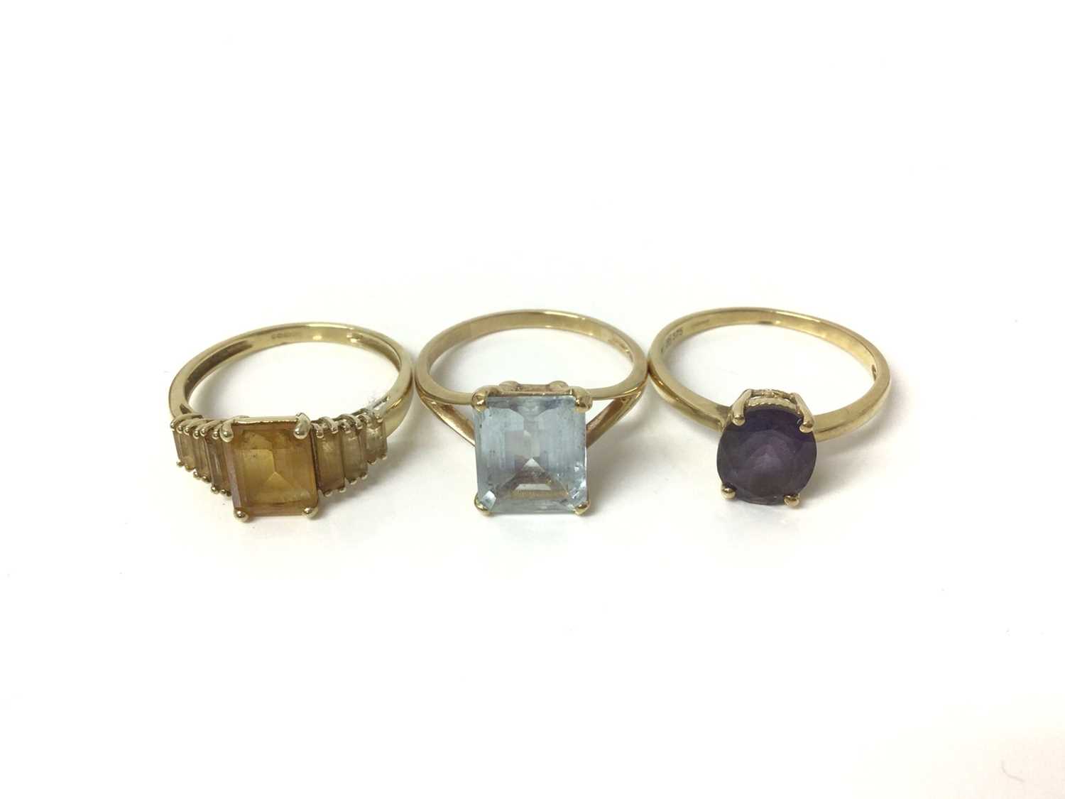 Three 9ct gold gem set dress rings