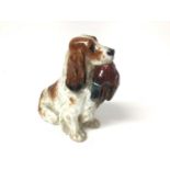 Royal Doulton figure of a spaniel with a pheasant in its mouth, 13.5cm high