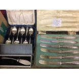 Six silver handled tea knives in a fitted case together with a silver butter knife and group of silv