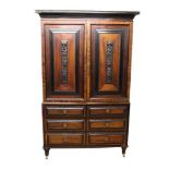 Early 19th century Dutch colonial hardwood and ebonised linen press, with ripple moulded cornice and
