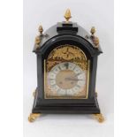 Late 19th century bracket clock with 8 day striking movement, arched brass dial with cast spandrel