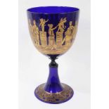 A large 19th century Bristol blue glass goblet, decorated in tooled gilt with a continuing band of c