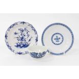 A Bow blue and white moulded saucer, a Worcester faceted blue and white saucer and a Worcester tea b
