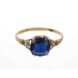 Sapphire and diamond ring with a cushion cut blue sapphire