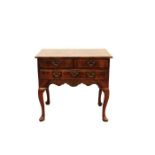 Early 18th century walnut lowboy with pointed pad feet