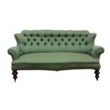 Victorian green button upholstered sofa, of small size, serpentine seat on turned legs and castors,