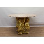 19th century carved giltwood cherub pedestal with circular pink veined marble circular top