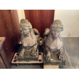 Impressive pair of concrete garden sculptures in the form of sphinxes, 107cm long