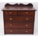 19th century oak miniature chest of drawers with ledge back and brass bun handles