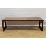 Antique Chinese padouk low table, raised on carved end supports and brackets, 127cm long x 37cm deep