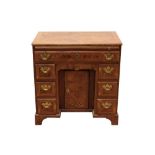 Early 18th century burr walnut and yew wood crossbanded kneehole desk