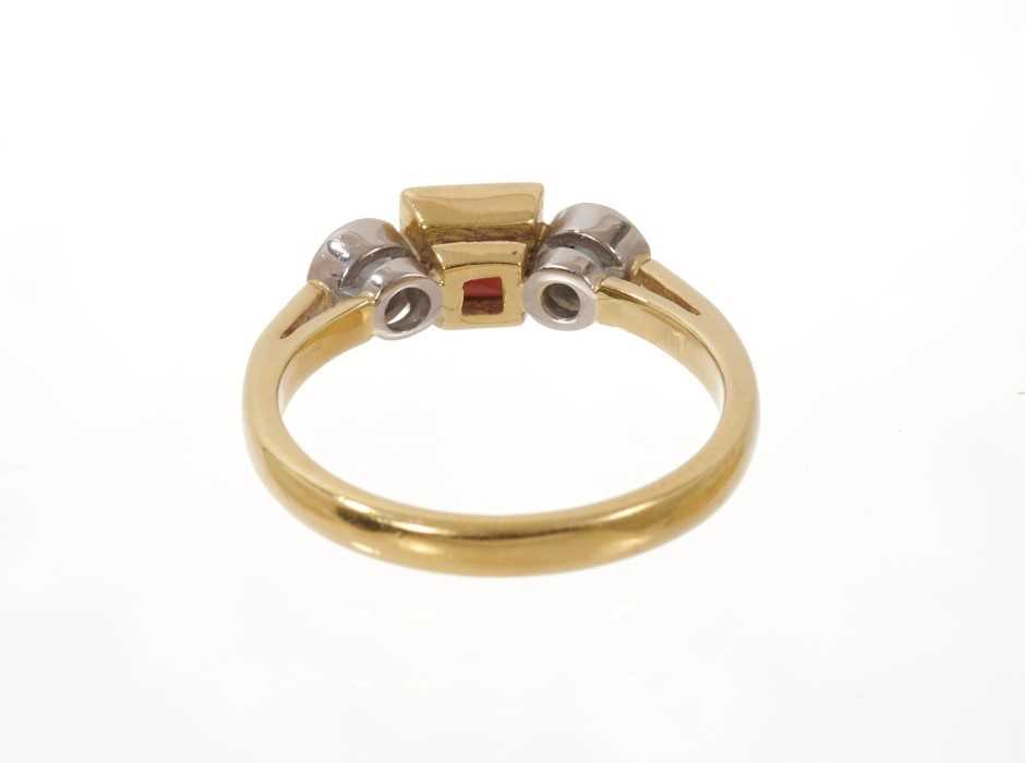 Garnet and diamond three stone ring with a square step cut garnet flanked by two round brilliant cut - Image 3 of 3