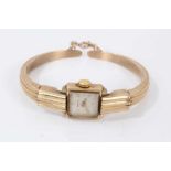 Ladies Art Deco ‘Odeonesque’ Zenith 9ct gold bangle watch with rectangular dial in gold case on a go