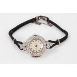 1920s ladies diamond and platinum cocktail wristwatch, the circular dial with diamond set bezel and