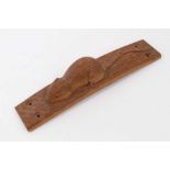 Carved oak furniture mount, in the manner of Robert Mouseman Thompson, of bowed form, 20cm long