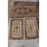 Pair of Eastern rugs together with one other