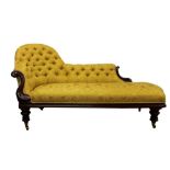 Victorian mahogany chaise longue, with yellow satin foliage upholstery on faceted legs and castors,