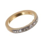 Diamond eternity ring with a half hoop of seven brilliant cut diamonds in platinum grain setting on