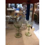 A pair of Victorian etched green wine glasses and a Victorian decanter