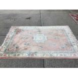 Large Chinese wash rug with floral decoration on pink, green and cream ground, 370cm x 268