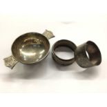 Silver quaich together with two silver napkin rings (3)