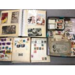 Collection of cigarette cards, two stamp albums and a postcard album