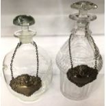 Georgian cut glass decanter and one other decanter, both with silver spirit labels