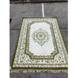 Large good quality cream and green rug, 274cm x 185cm