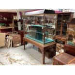 Good quality brass bound glass jewellers display cabinet of large proportions, on mahogany square ta