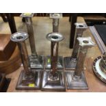 Three pairs of silver plated candlesticks