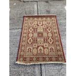 Belgian wool rug with geometric decoration on red and gold ground