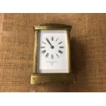 Goldsmiths' & Company brass carriage clock and key