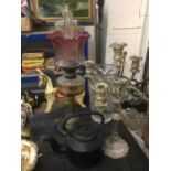 Brass oil lamp with glass shade, together with a Queen Anne style candelabra, iron kettle