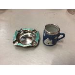 Silver and enamel ashtray, together with a miniature Wedgwood silver mounted mug (2)