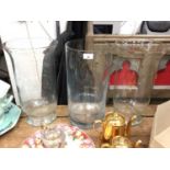 Pair of large glass vases/storm lanterns, together with another large cylindrical vase (3)