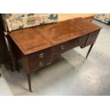 Antique mahogany kneehole desk with five drawers on reeded turned legs, 140.5cm wide, 50.5cm deep, 7
