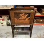 Early 20th century oak magazine rack with leather panel depicting flying geese, together with a simi