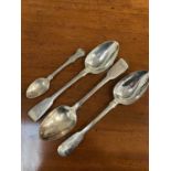 Three William IV silver fiddle pattern table spoons with engraved crest and a Victorian silver teasp