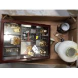 Display cabinet with miniature clocks and sundries
