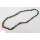 Chinese green jade/hard stone and carnelian polished bead necklace with silver gilt clasp, 70cm long